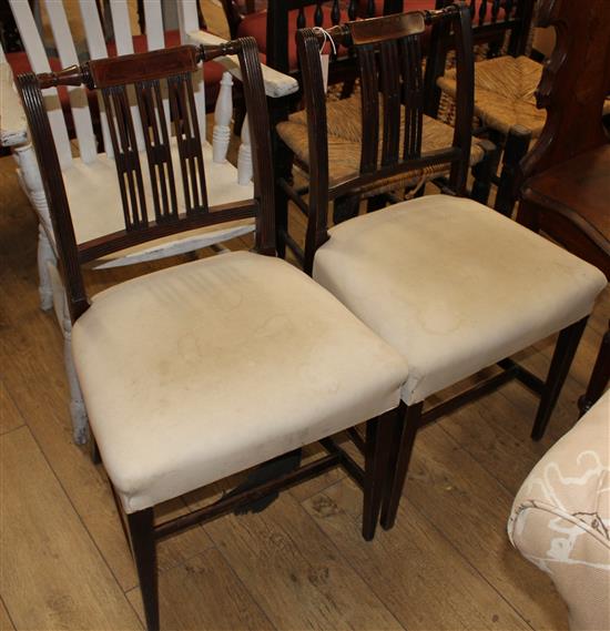 A pair of Lancashire style rush seat dining chairs and a pair of George III style mahogany dining chairs